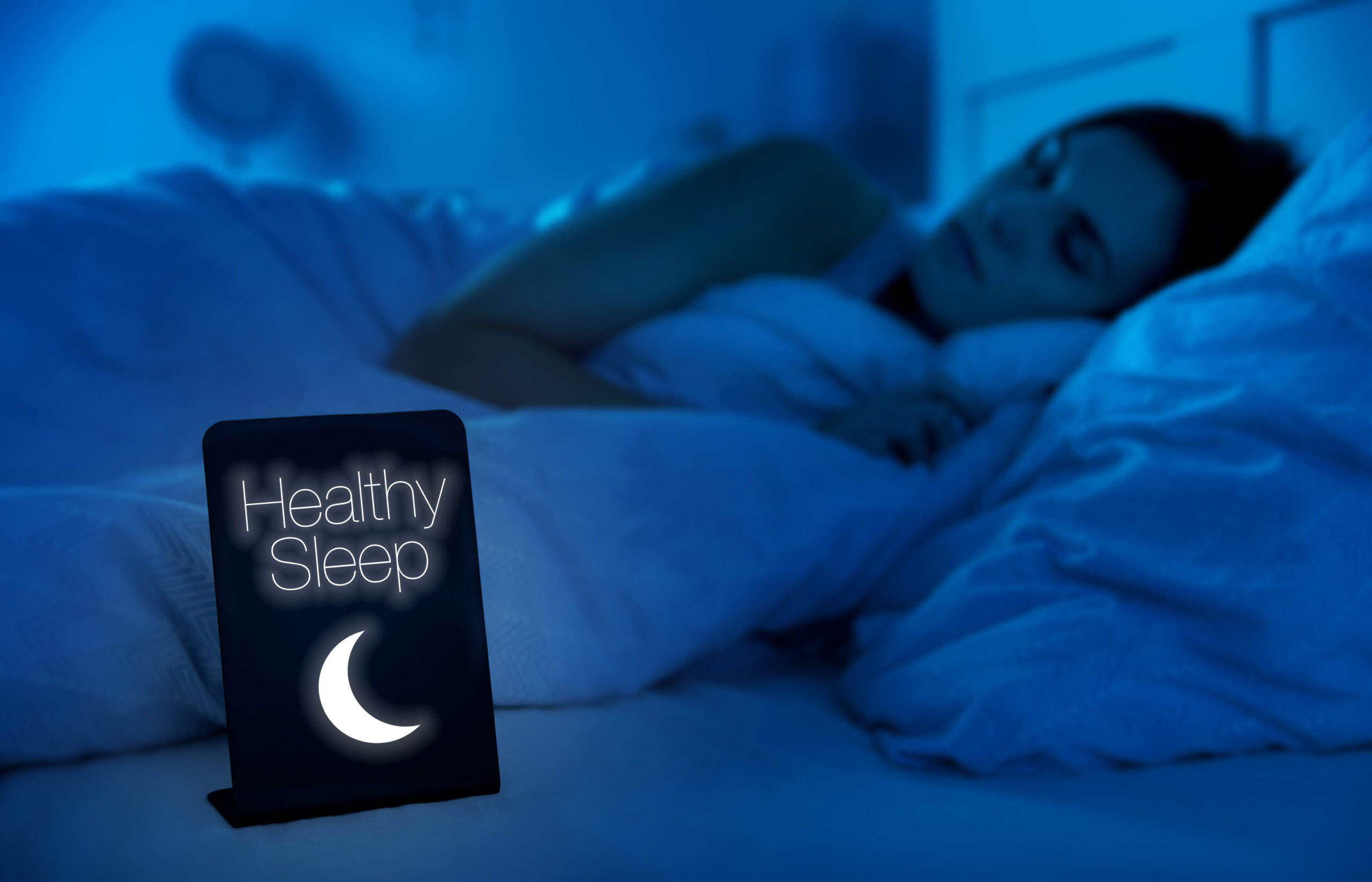 Woman healthy sleeping in bed at night